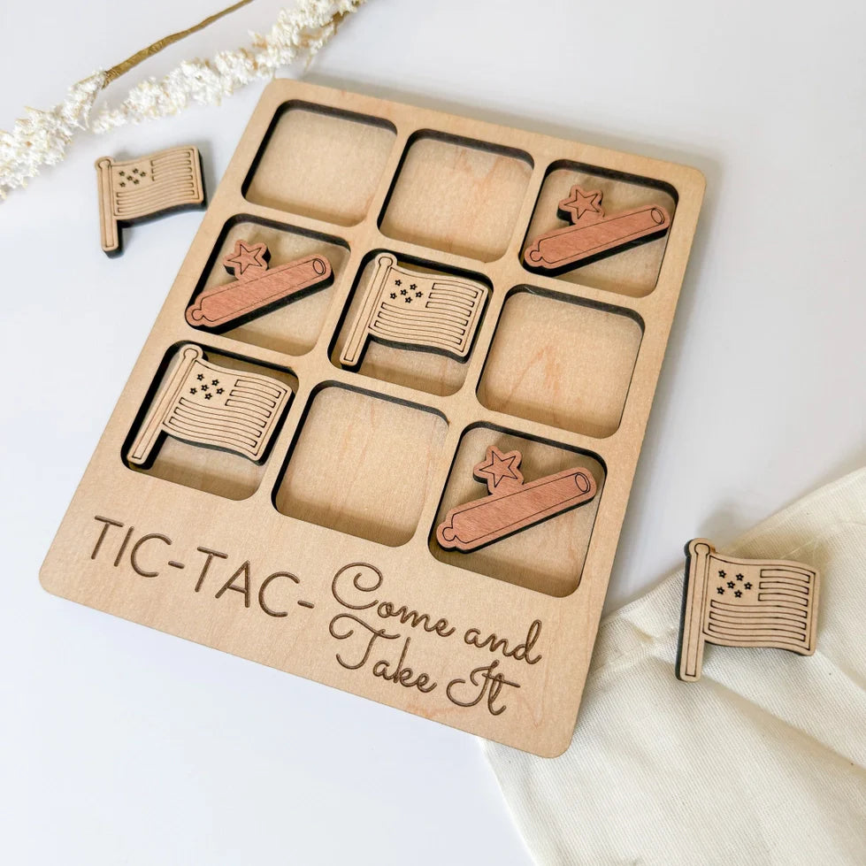 a close up of a tray of wooden magnets