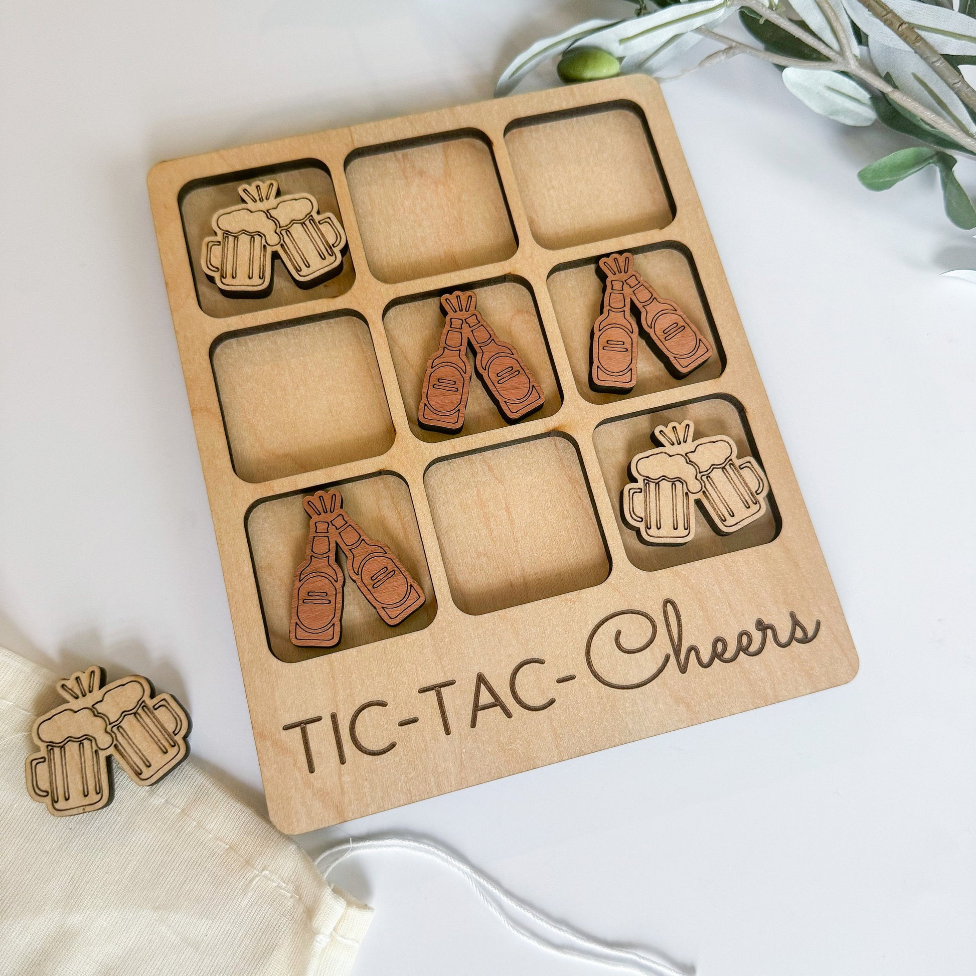 a wooden box with a bunch of pins in it