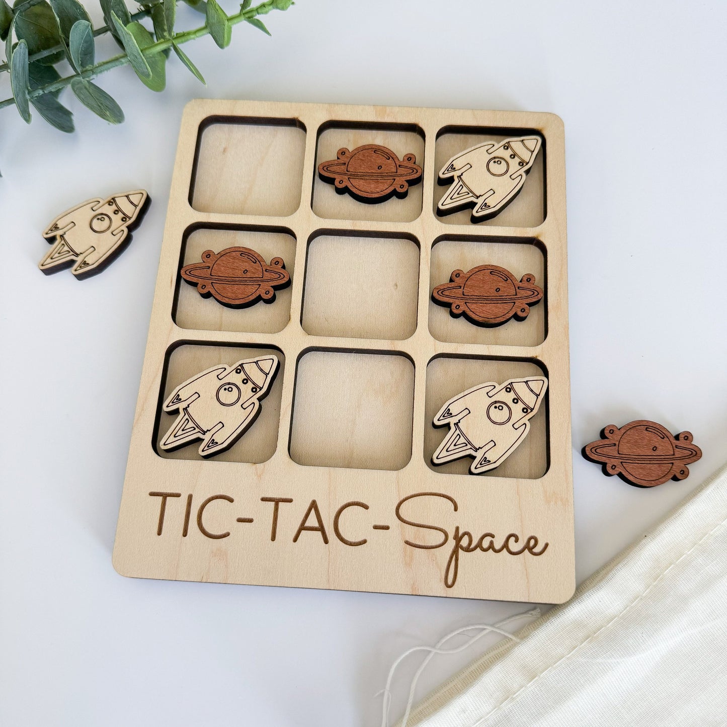 a wooden tic - tac - space game with space shuttles