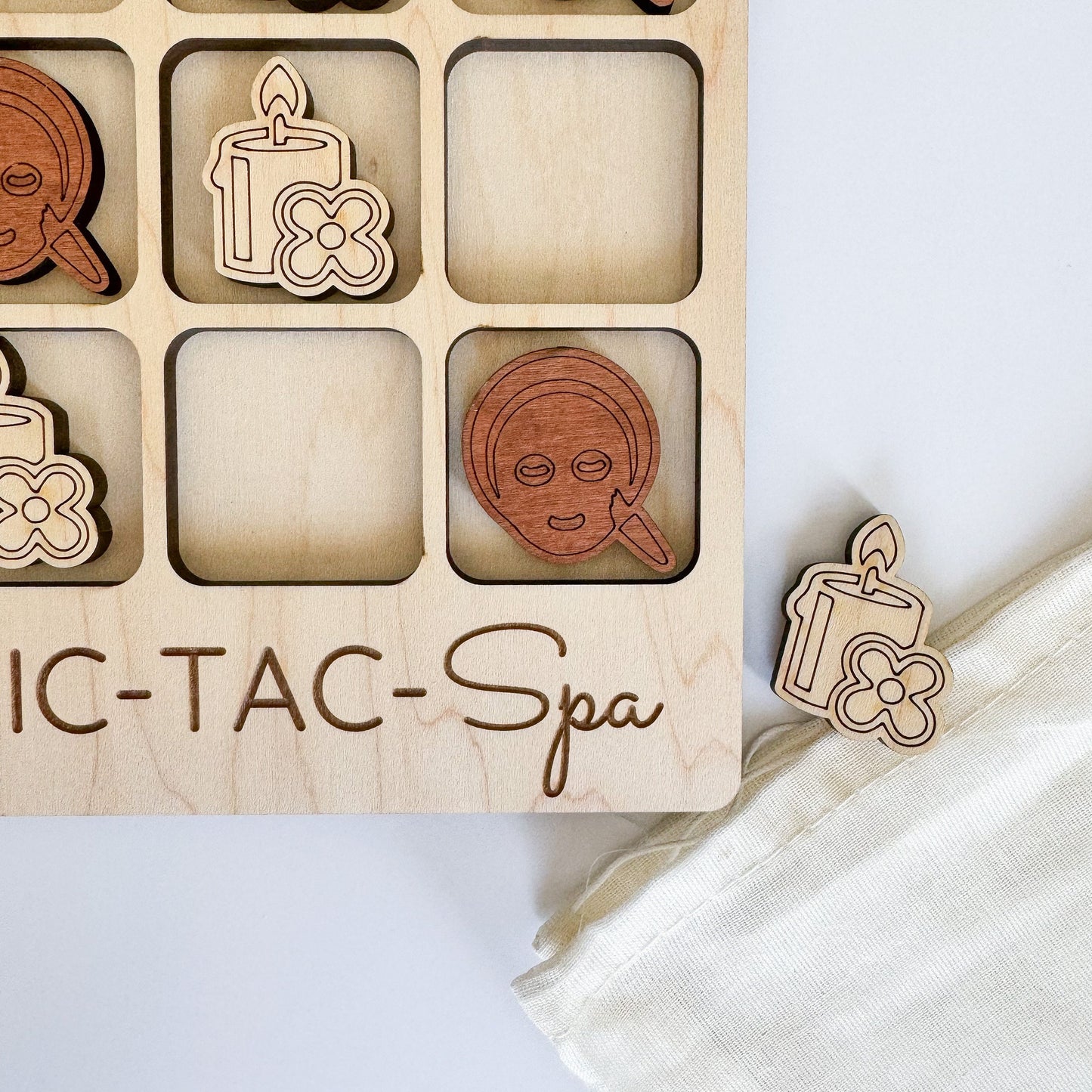 a wooden box with wooden cutouts of women's faces