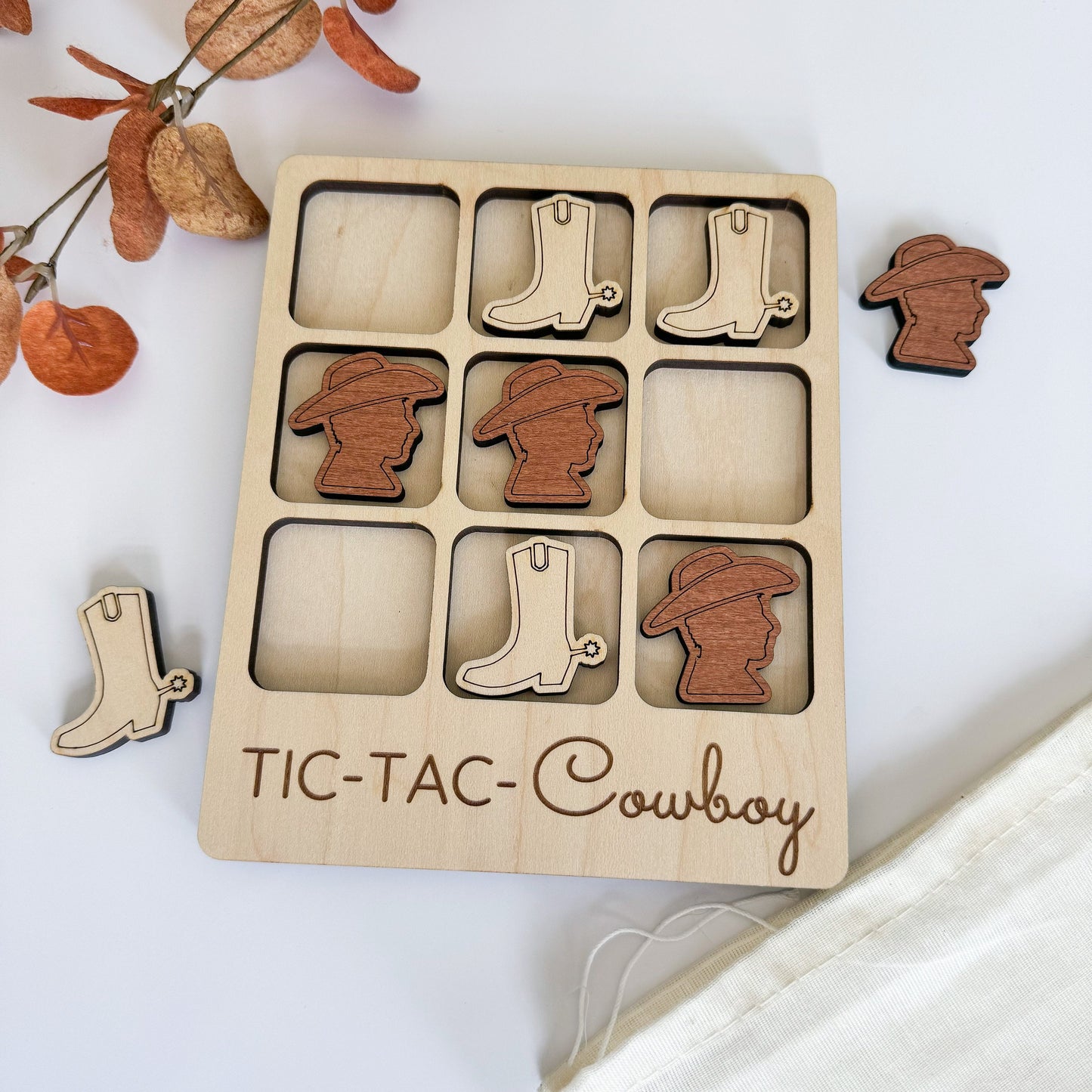 a wooden cutout of a cowboy's boot and boots