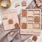 a wooden tic-tac game designed for girls, with a crown and a castle-shaped tile on display.