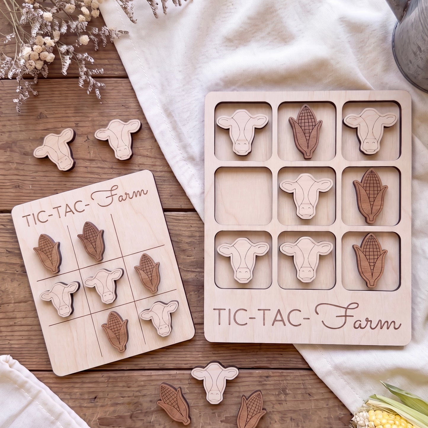 a wooden game board and a wooden puzzle with animal shapes, both labeled "TIC-TAC-Farm".