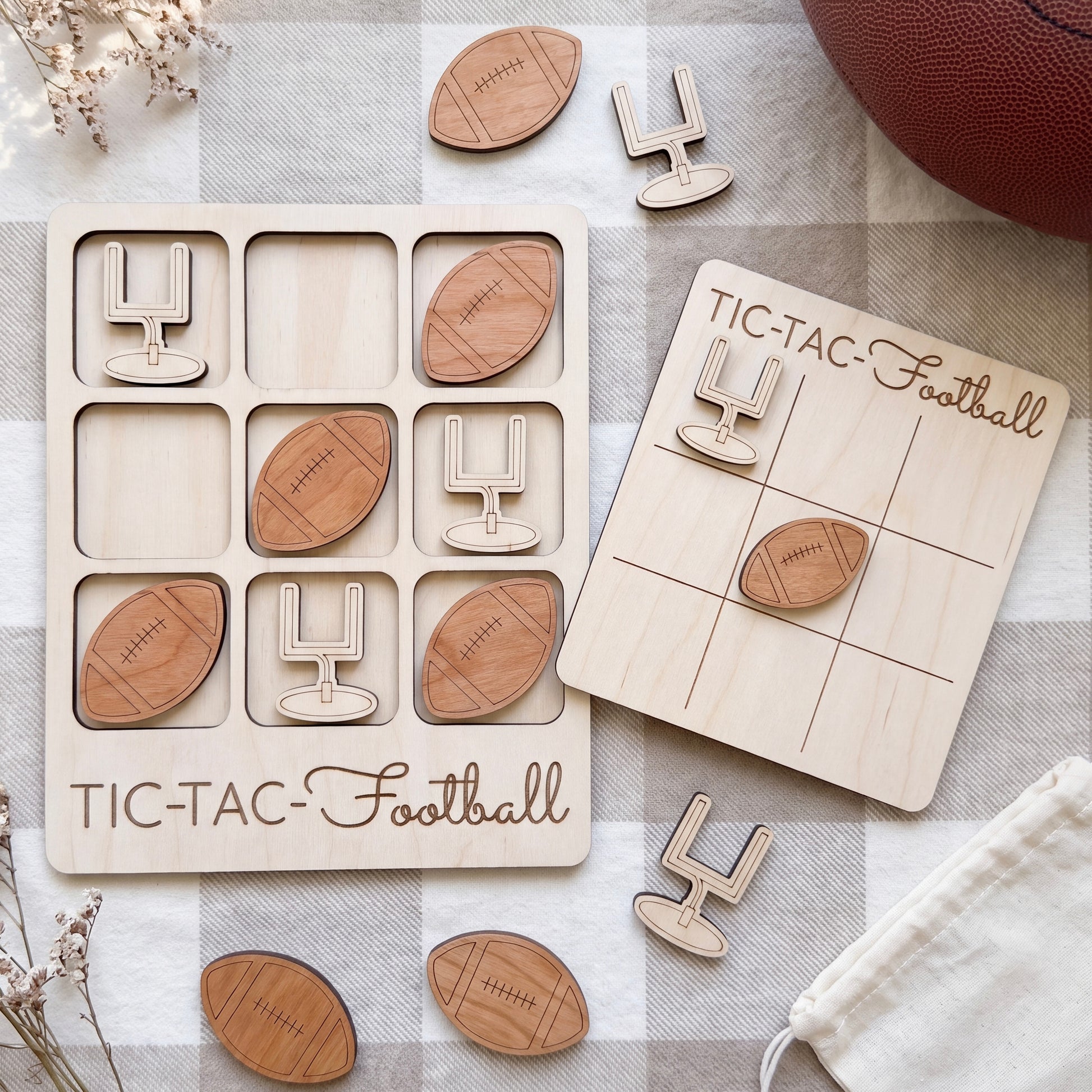 a wooden tic-tac football game set with various wooden footballs and a tic-tac football board.