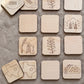 a collection of wooden coaster-shaped objects, each featuring a different design or symbol. The coasters are arranged in a grid-like pattern, with some overlapping each other. The coasters depict various themes, such as football, oil drilling, flowers, and food, showcasing a diverse range of designs and subjects.