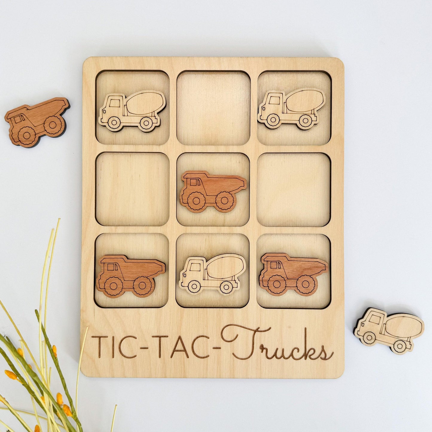 a wooden puzzle with cars and trucks on it