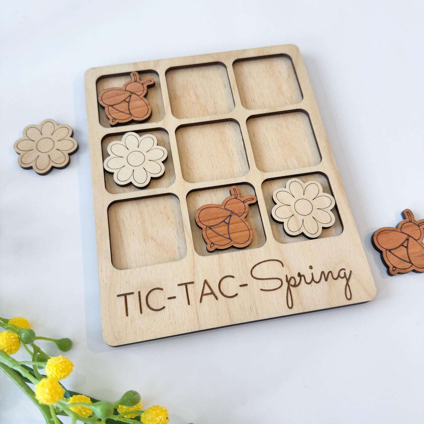 a wooden tic - tac - spring game with flowers and teddy bears