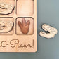 a picture of a wooden puzzle with a picture of a hand and a pair of