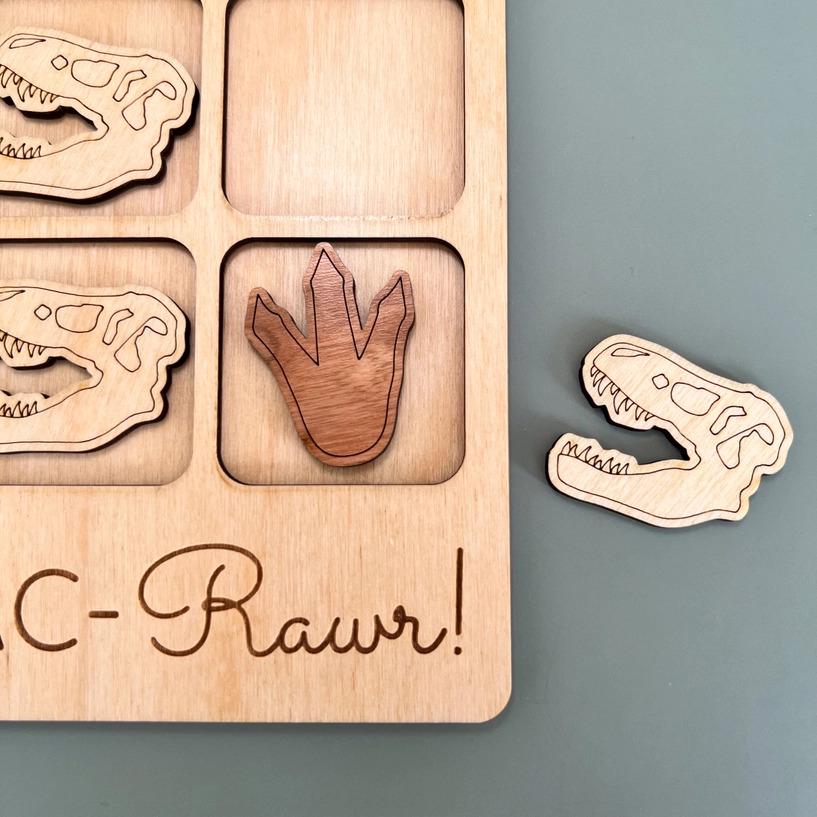 a picture of a wooden puzzle with a picture of a hand and a pair of