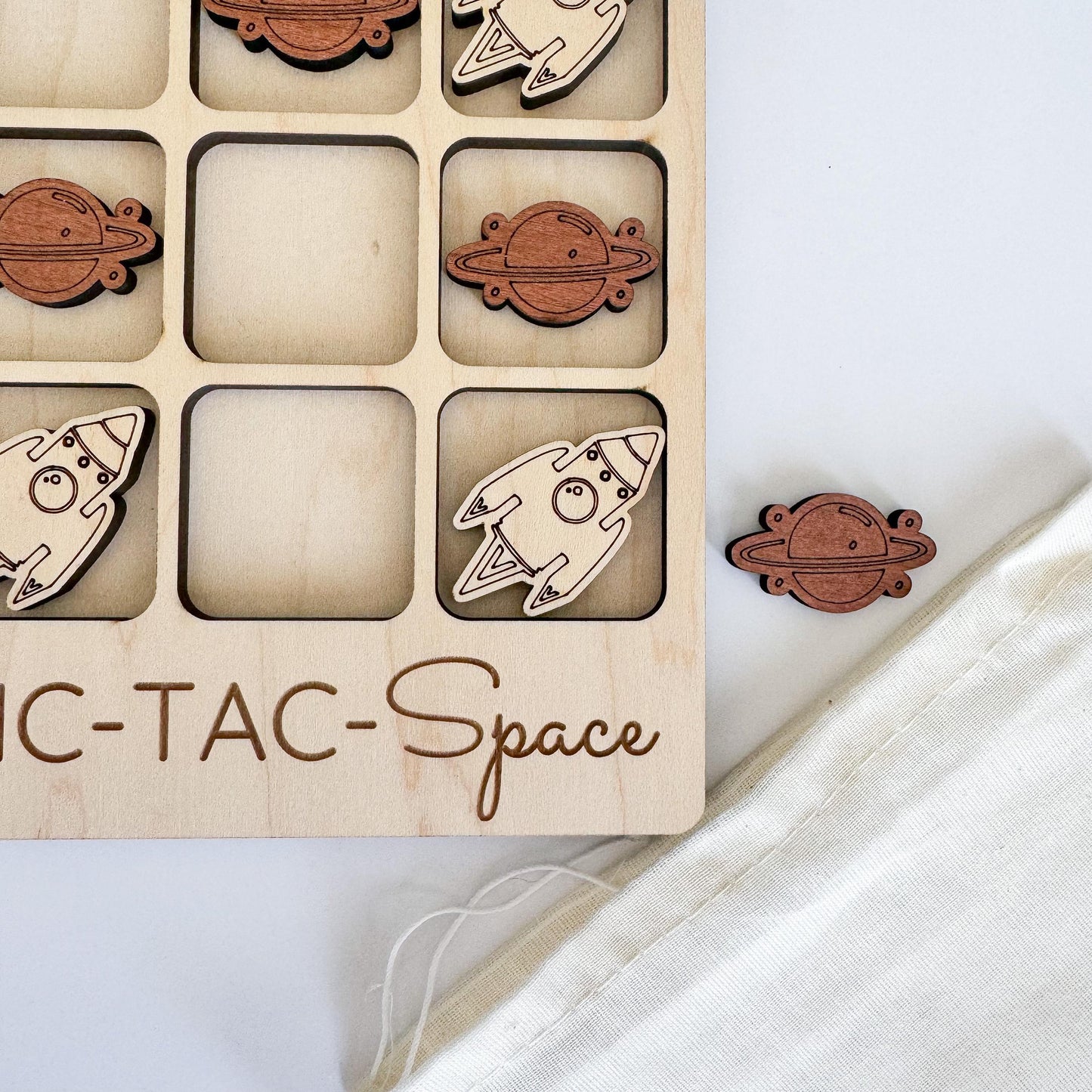a wooden toy with a space themed design