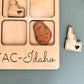 a wooden magnet with a picture of a potato and a heart
