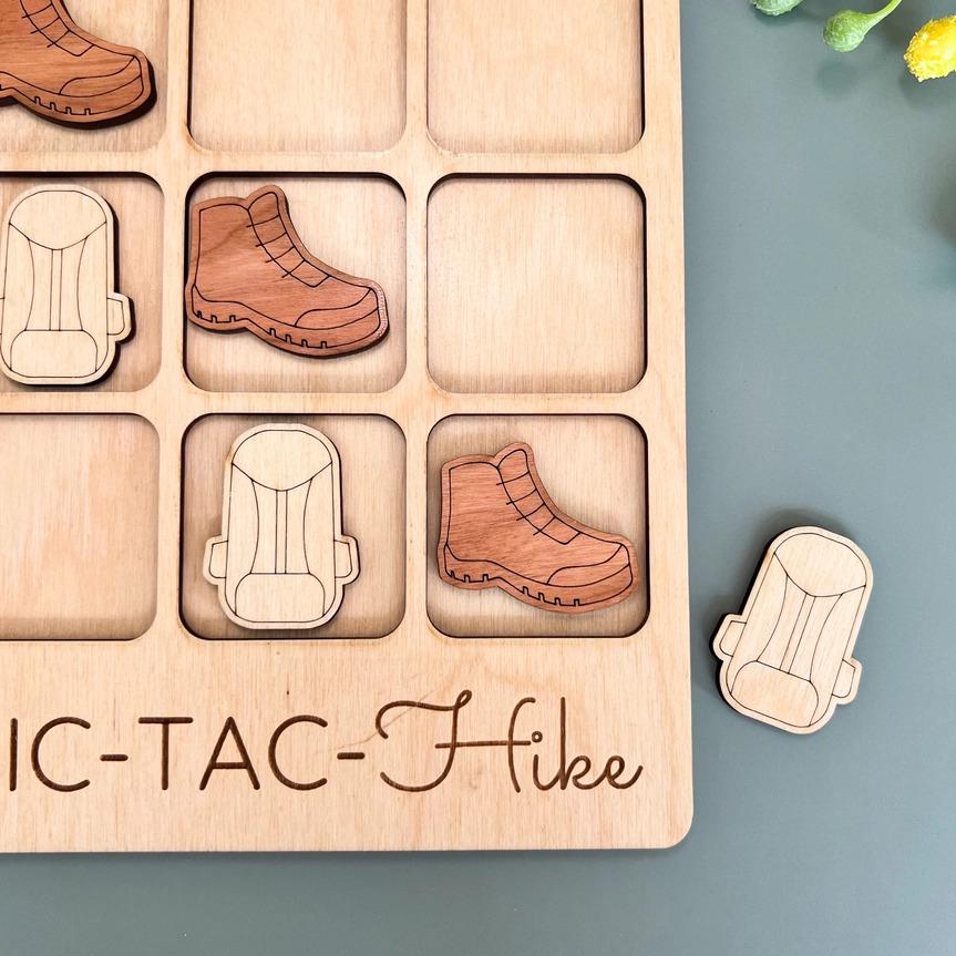 a wooden puzzle with a picture of a pair of shoes and a pair of boots
