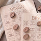 a wooden bingo card with various football-related questions and puns, such as "Mascot Closeup", "Injury Timeout", "Fan with Face Paint", "Repair", "Celebrity in Crowd", and "Offensive Interference".
