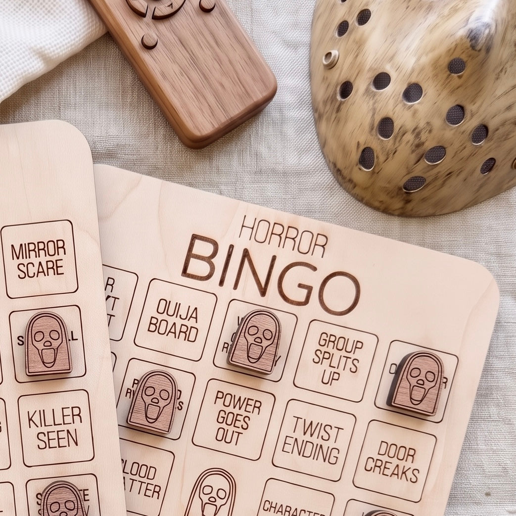 a wooden bingo board with the word "HORROR" written on it, along with various game elements such as a wooden remote control and a wooden object with holes.