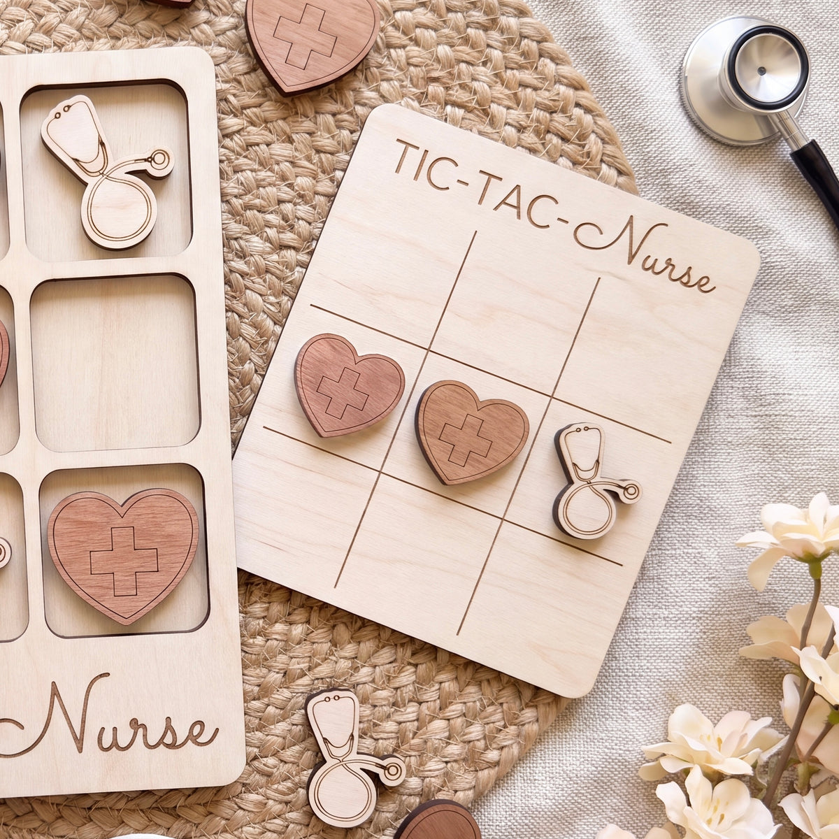 a wooden tic-tac game board labeled "TIC-TAC-NURSE" and various wooden heart-shaped game pieces, including a stethoscope, scattered on a woven surface.
