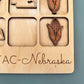 a wooden magnet board with magnets on it