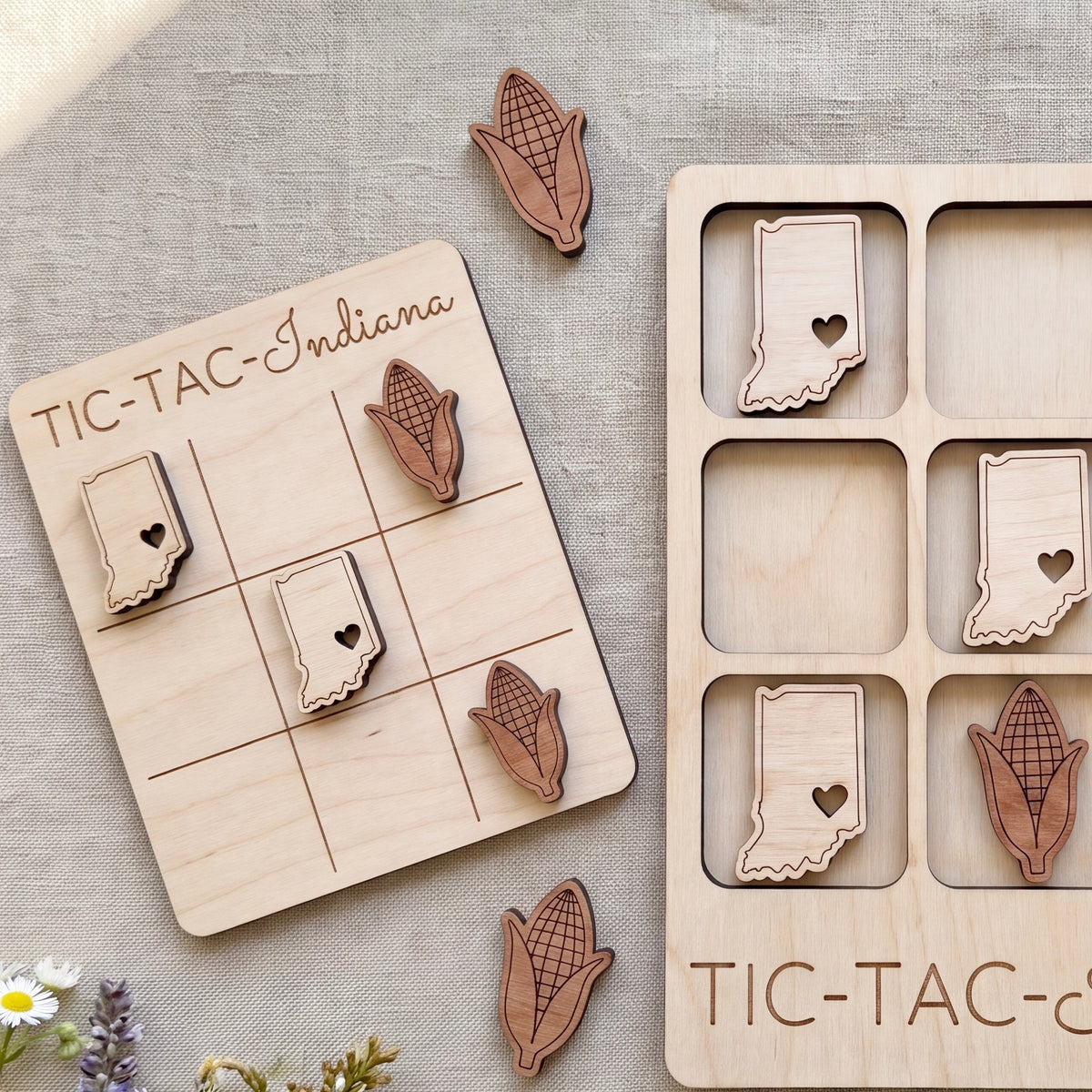 a wooden tic-tac game with a light wood texture and a light wood border. The game board is decorated with wooden cornucopia cutouts in the shape of the states of the United States, including Indiana. The game pieces are also made of wood and are placed on the game board.