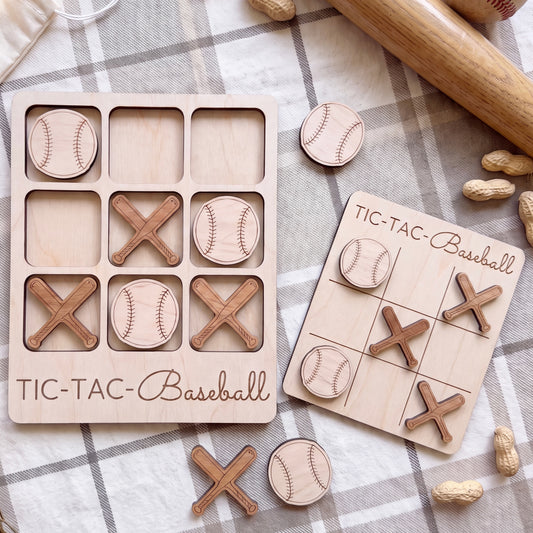 A wooden tic-tac game set with baseball-themed pieces, including a game board and tic-tac pieces, along with some peanuts and a wooden bat.