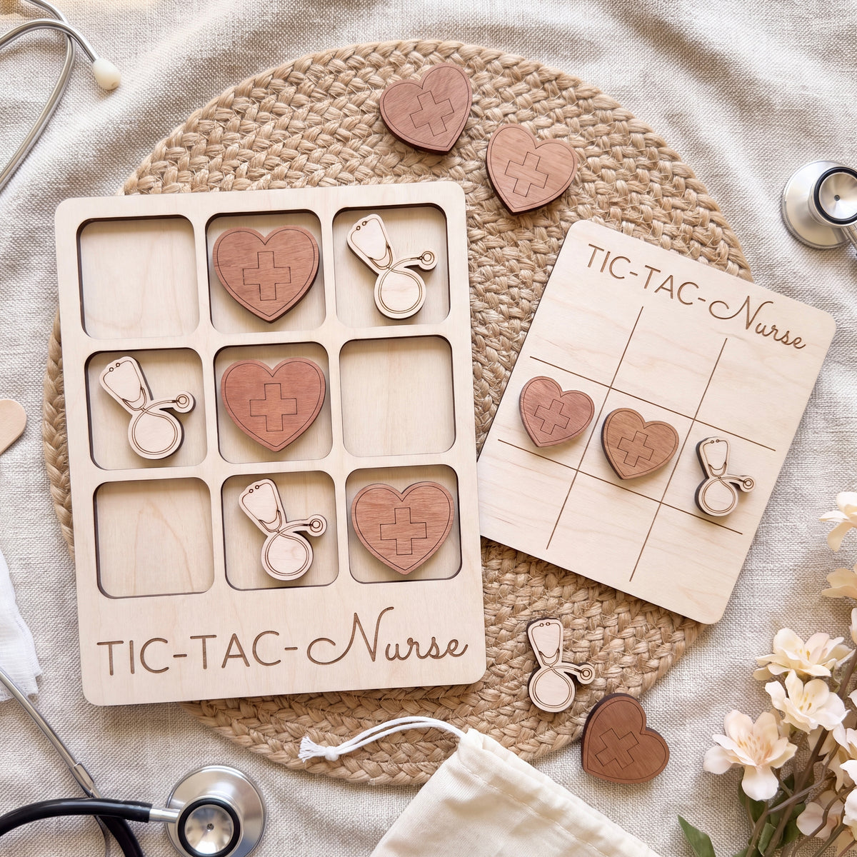 a wooden tic-tac game designed for nurses, with a tic-tac board and wooden hearts shaped like stethoscopes and hearts. The game is surrounded by various medical items, including a stethoscope, a bag, and some flowers.