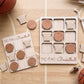 a wooden tic-tac basketball game with wooden basketballs and wooden basketball nets.
