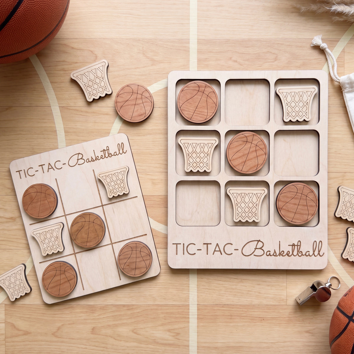 a wooden tic-tac basketball game with wooden basketballs and wooden basketball nets.