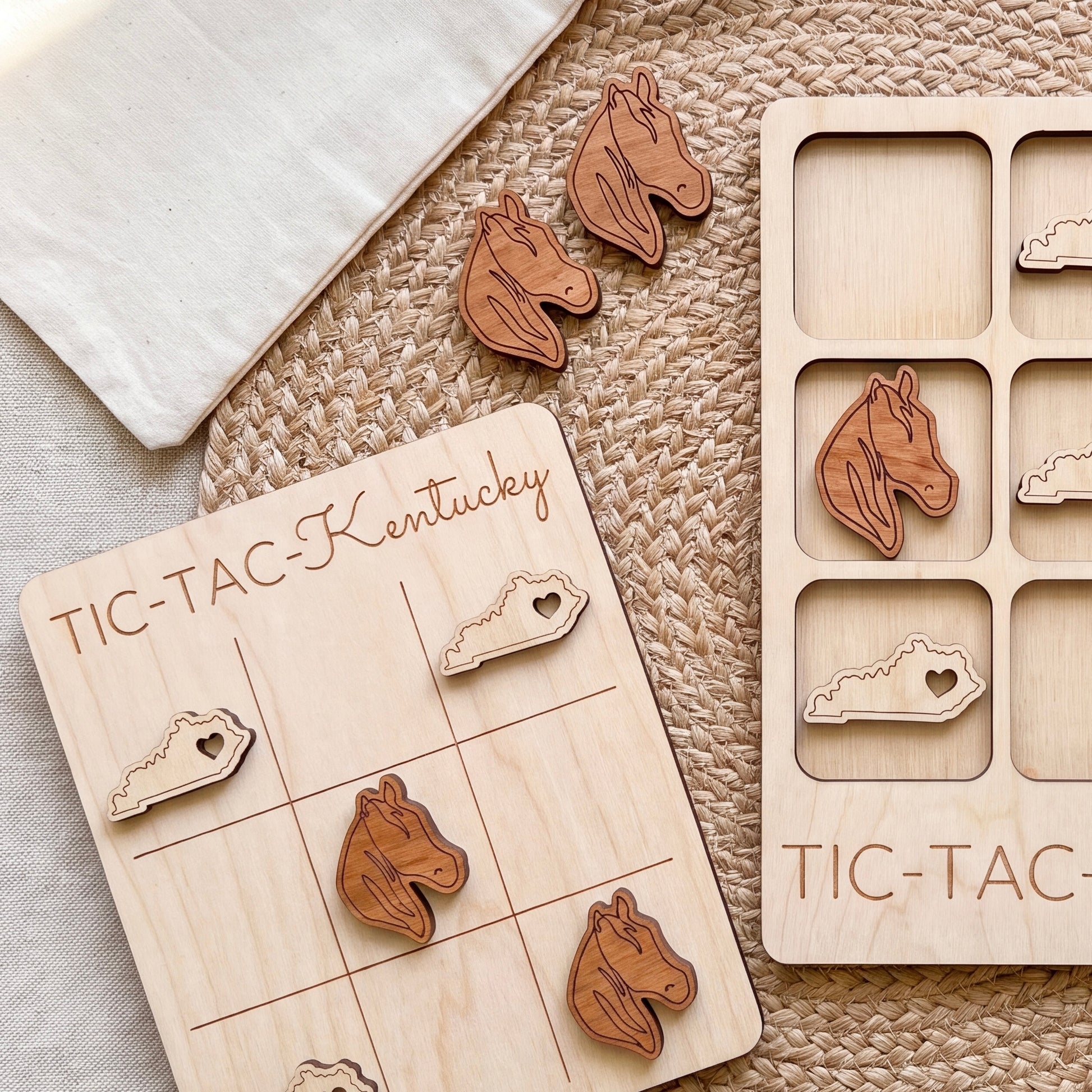 a wooden tic-tac game board with wooden horse head tiles and a wooden tic-tac card with wooden horse head tiles.