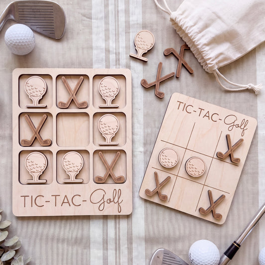 a wooden tic-tac golf game set with golf balls and clubs, along with a bag of golf clubs and a golf ball.