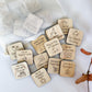 a bunch of wooden magnets with words on them