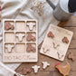 a wooden tic-tac farm game with tractor and tractor-related shapes, as well as a wooden chicken and tractor set, all placed on a wooden surface.