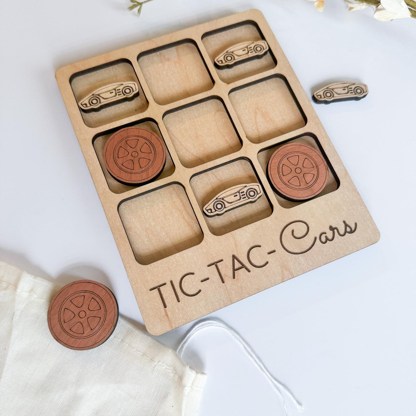 a wooden tic - tac - cou game with wooden buttons