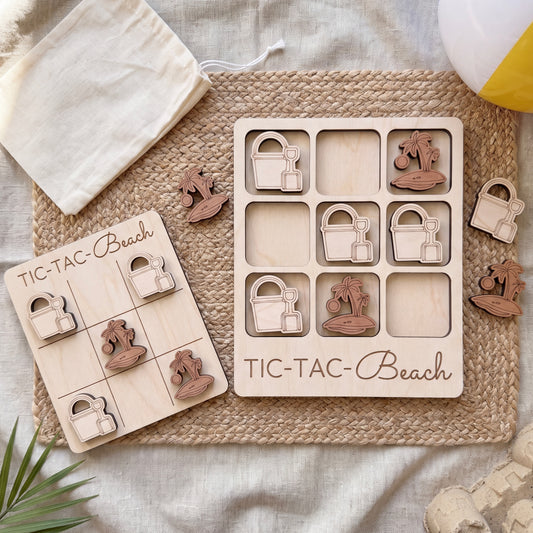 a wooden tic-tac game board labeled "TIC-TAC-Beach" and a set of wooden tic-tac pieces with beach-themed designs.