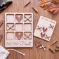 a wooden tic-tac game with deer heads and cross-shaped pieces, along with some bullet casings on a wooden surface.