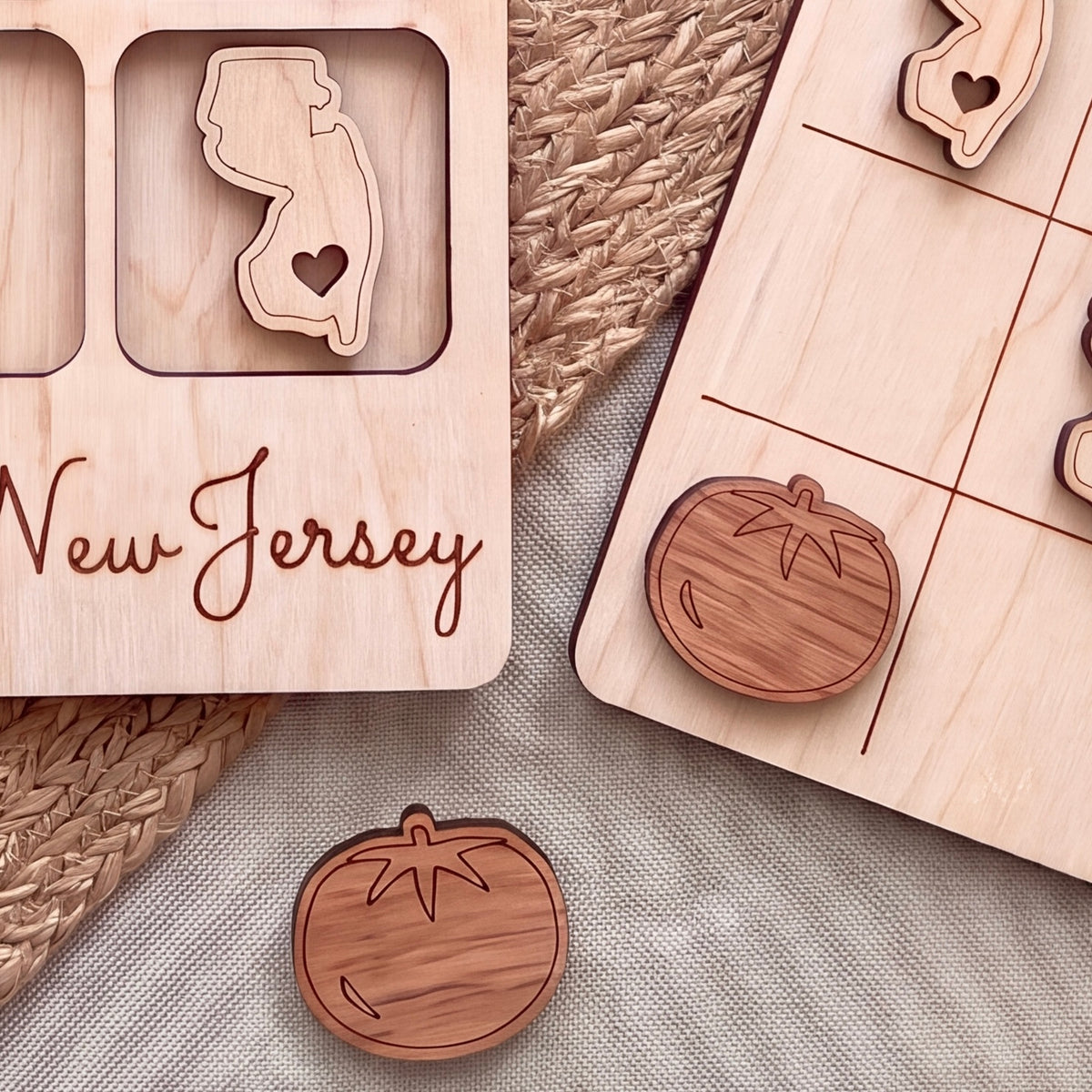 a wooden frame with a New Jersey state map and a wooden tic-tac game board with wooden tiles.