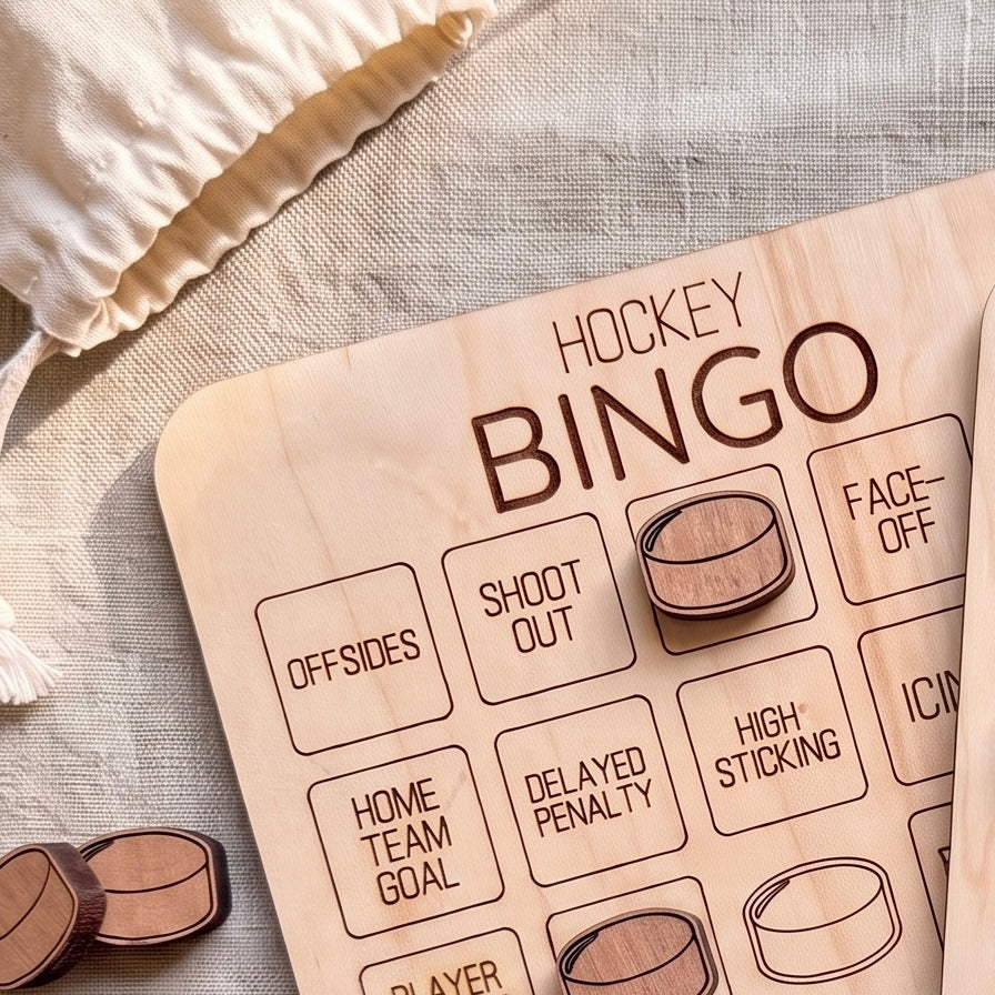 A wooden bingo board with various hockey-related words and symbols, including "OFFSIDES", "SHOOT OUT", "HOME TEAM GOAL", "DELAYED PENALTY", "HIGH STICKING", and "FACE-OFF".