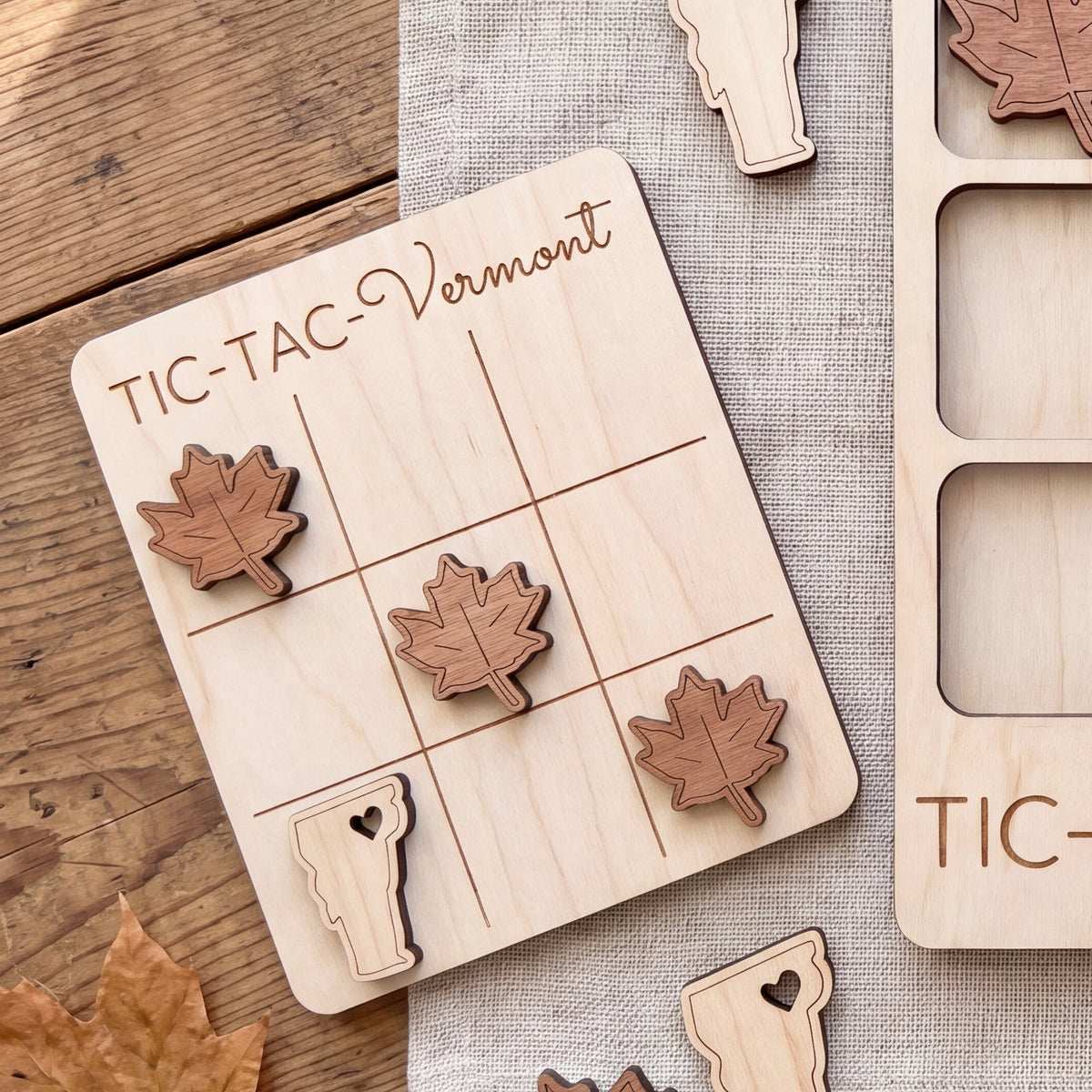 a wooden tic-tac game board with wooden pieces shaped like leaves and a wooden piece shaped like a state.