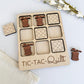 a wooden tictac - quilt box with a few pieces of it