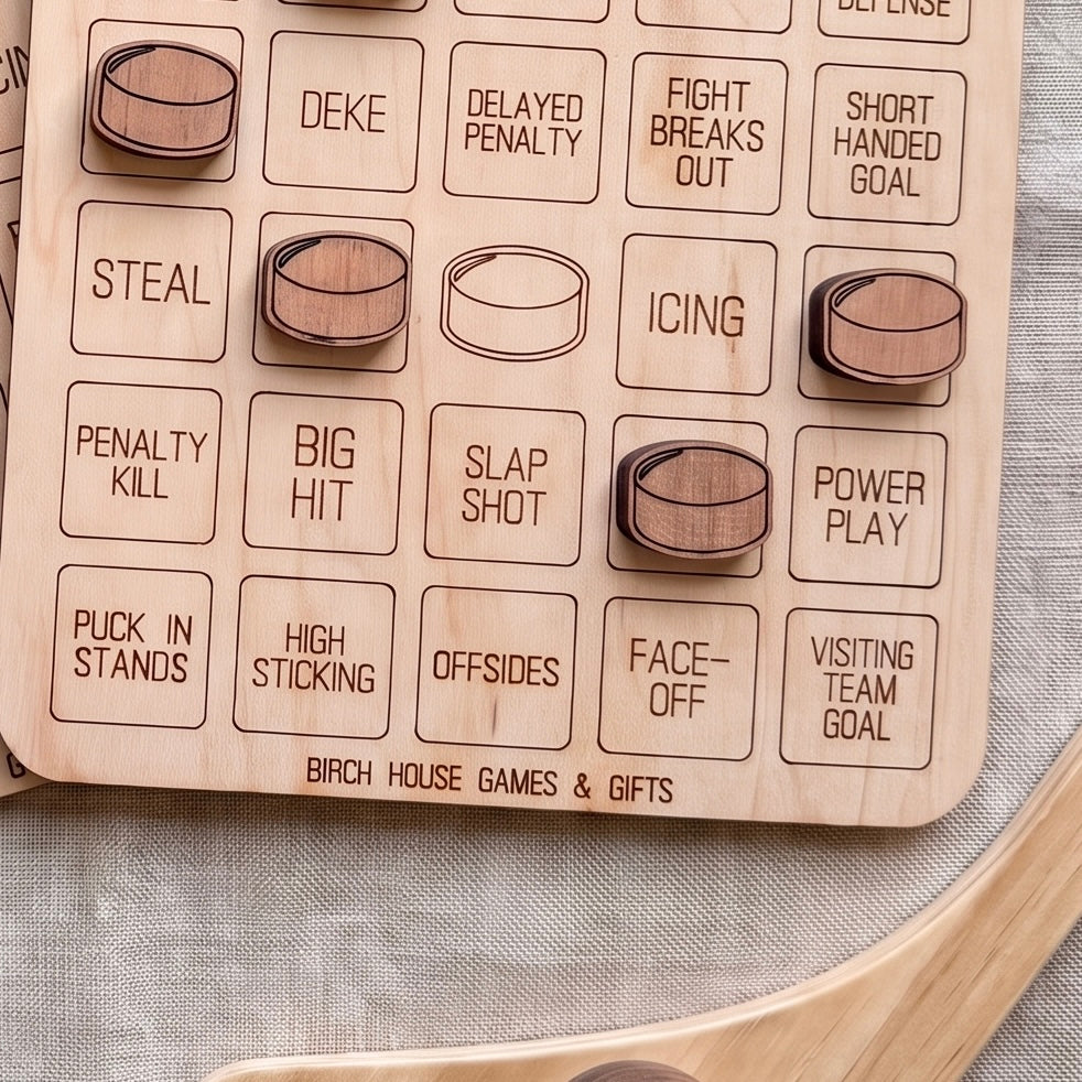 a wooden game board with various hockey-related terms and symbols, including penalties, shots, and team goals.