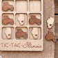 A wooden game board with a tractor and an Illinois state map as game pieces, along with the text "TIC-TAC- Illinois" printed on it.