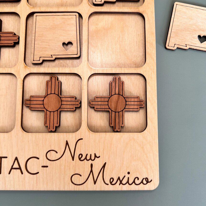 a close up of a wooden puzzle on a table
