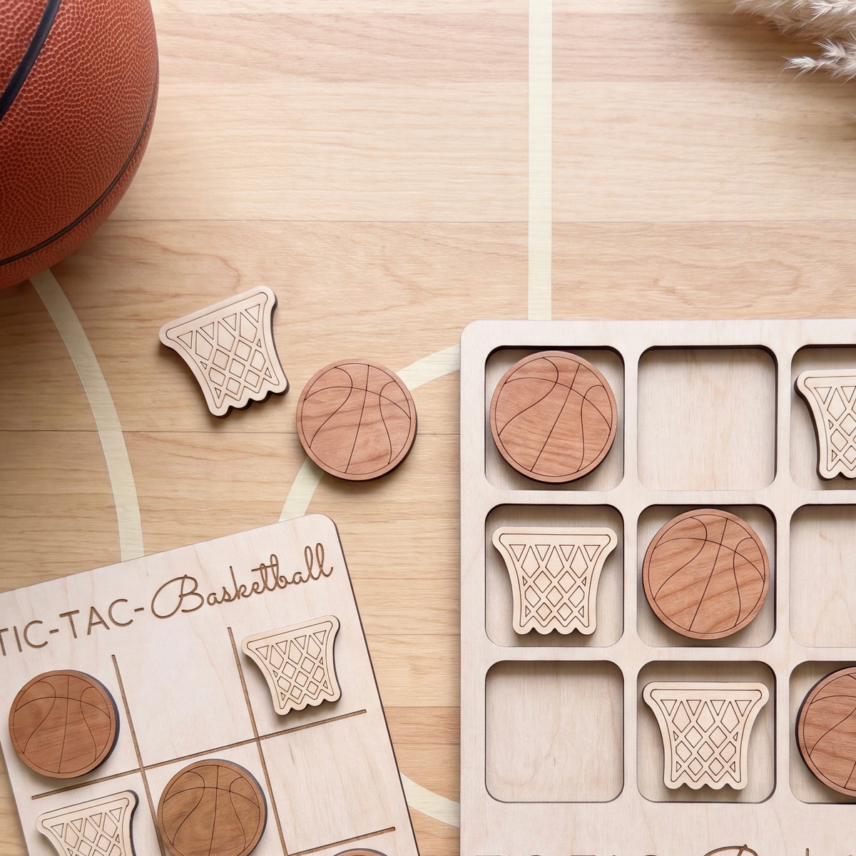 a wooden tic-tac game board with wooden basketballs and a basketball on a wooden floor.