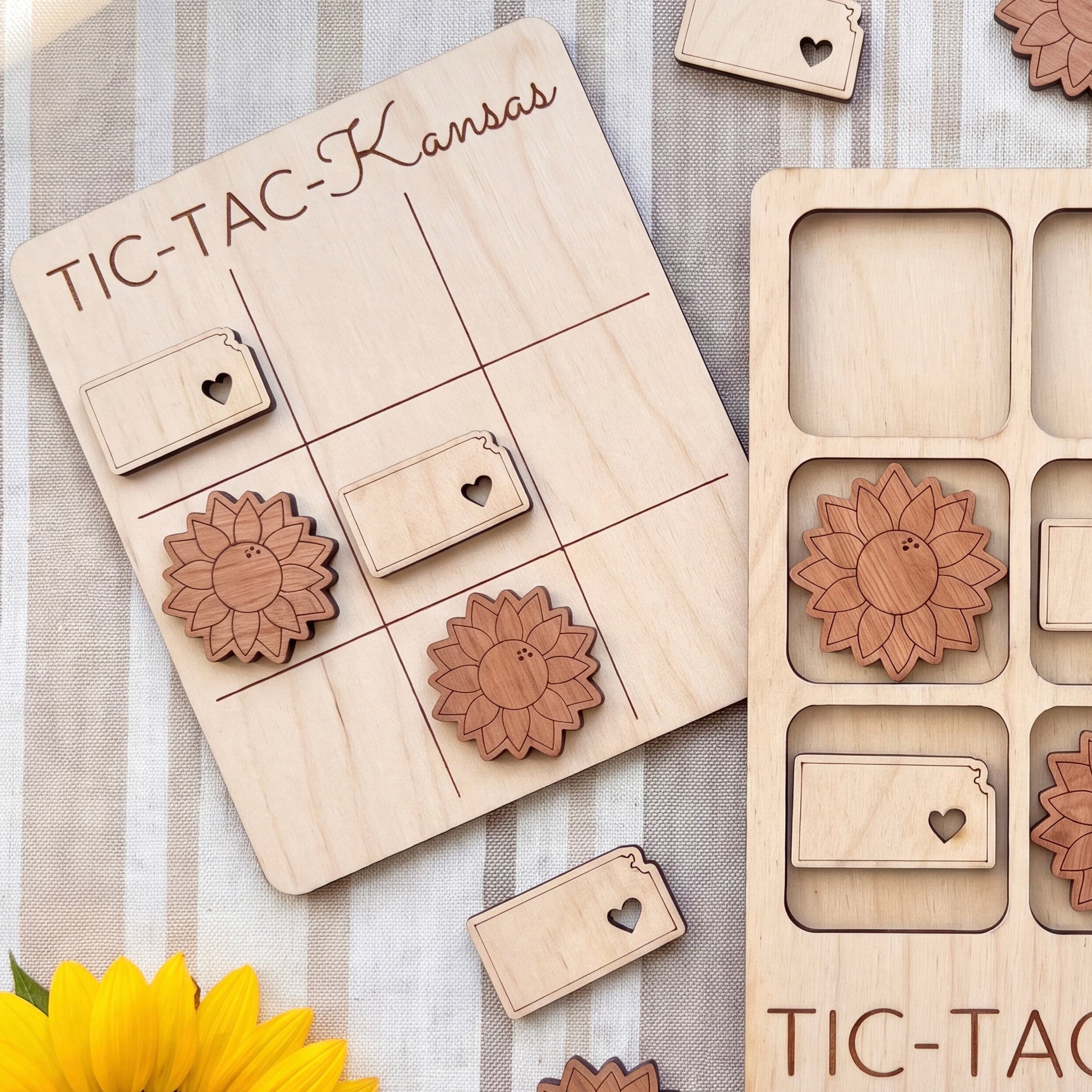 a wooden tic-tac game board with wooden pieces shaped like flowers, and a wooden frame with wooden pieces shaped like flowers.