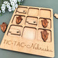 a close up of a wooden tray with magnets on it
