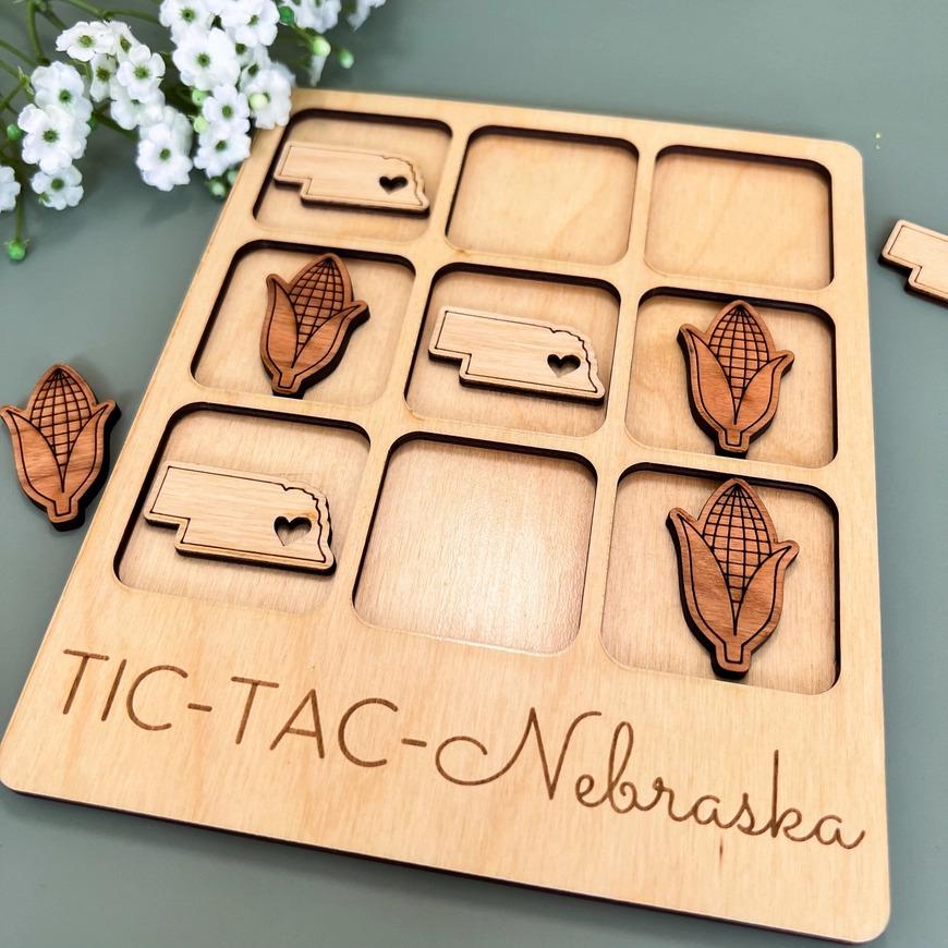 a close up of a wooden tray with magnets on it