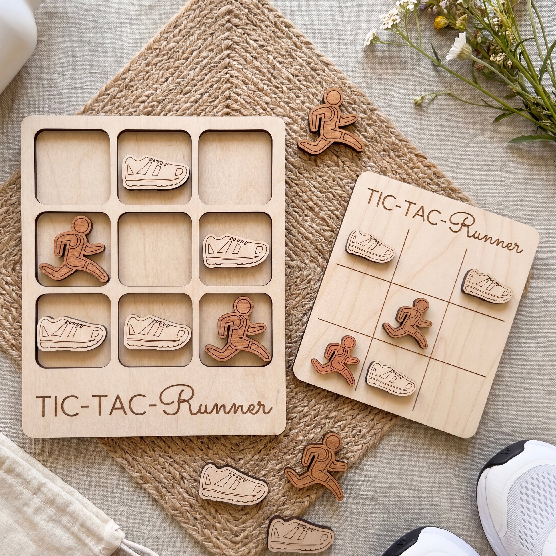 a wooden tic-tac runner game with various pieces in the shape of runners and a wooden board labeled "TIC-TAC-Runner".