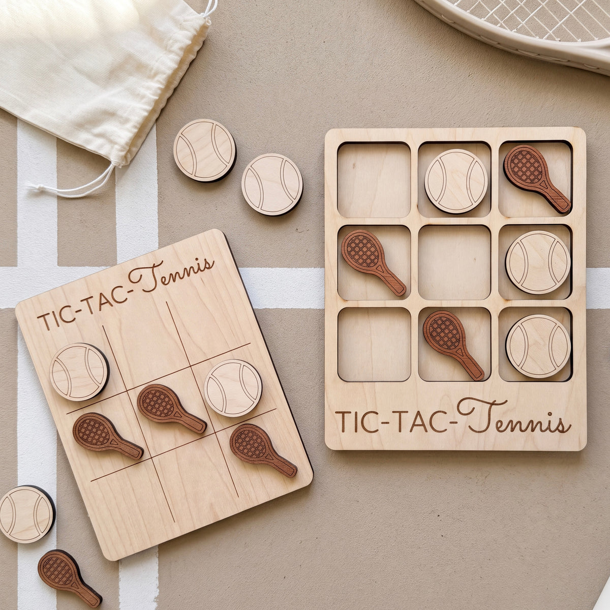 a wooden tic-tac game with tennis balls and wooden rackets as game pieces, placed on a table.