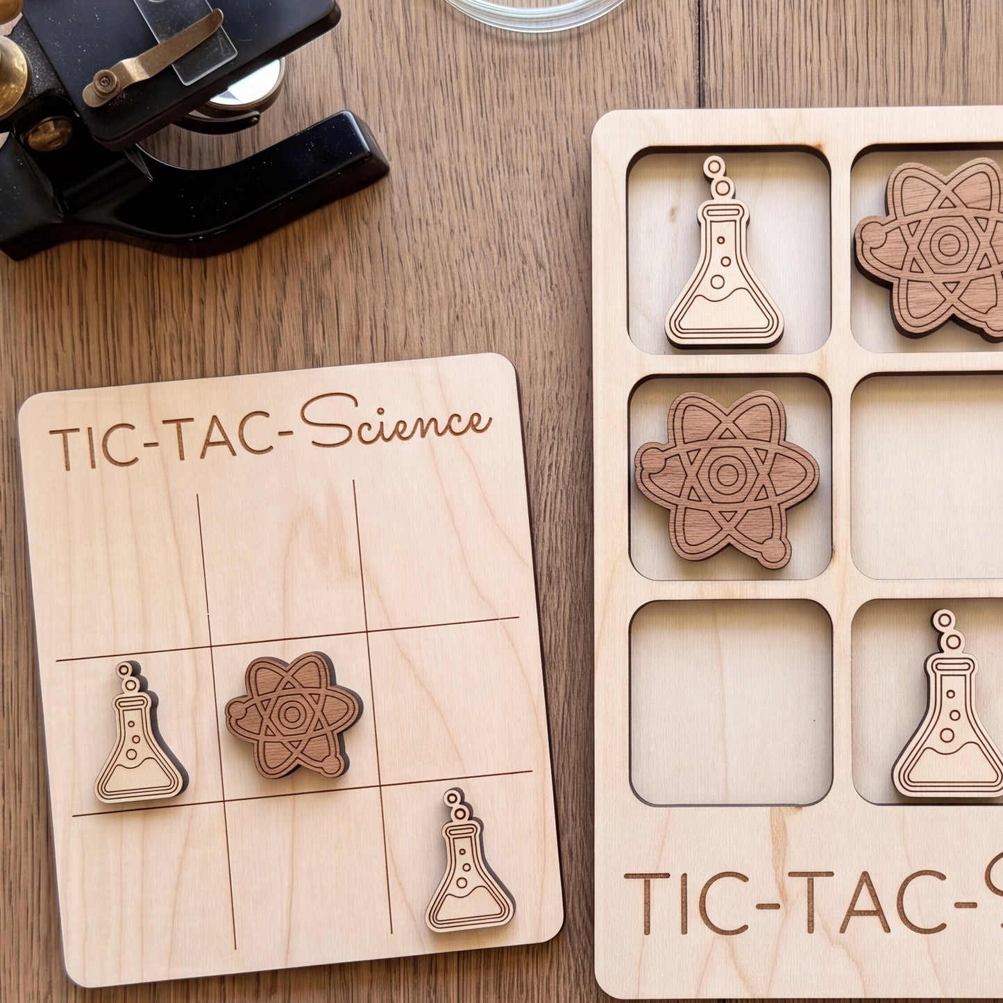 a wooden tic-tac game board with a science theme, along with several wooden tic-tac tokens shaped like laboratory equipment.