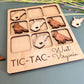 a wooden tray with a bunch of magnets on it