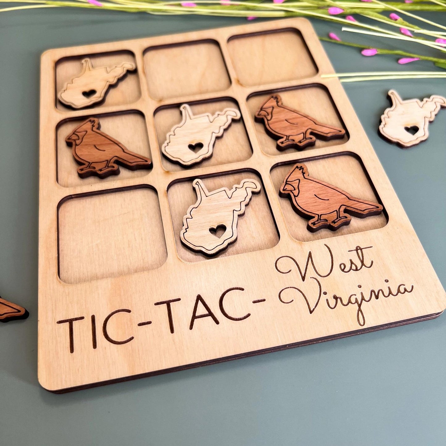 a wooden tray with a bunch of magnets on it